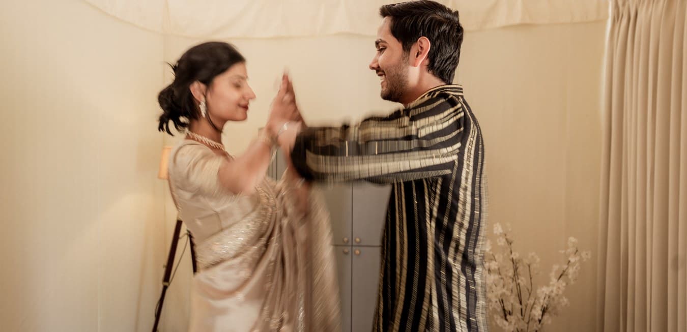 A bride and groom laughing together